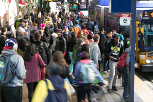 large group of customers waiting for the bus