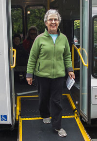 Woman exiting a shuttle using the ramp