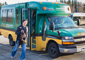 Community Shuttle bus dropping of a passenger