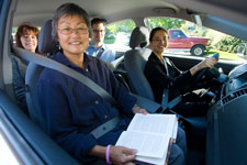 A group of riders in a van