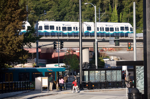 Bus and Link light rail stopping at transit center.